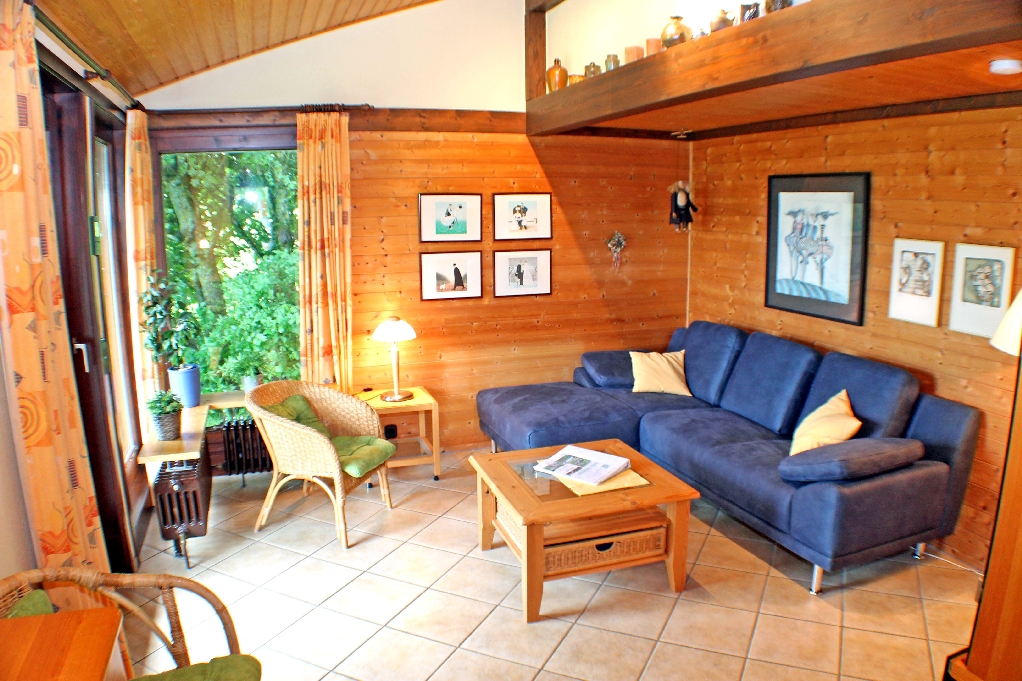 Wohnzimmer mit Sitzgruppe im Typ Scout 48